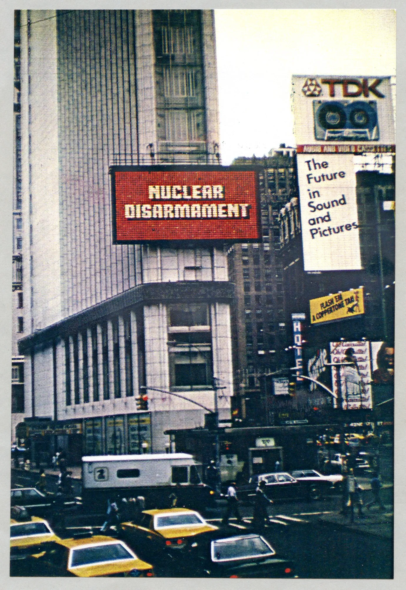 Colorful sign reading 'NUCLEAR DISARMAMENT' on an animated sign in Times Square.