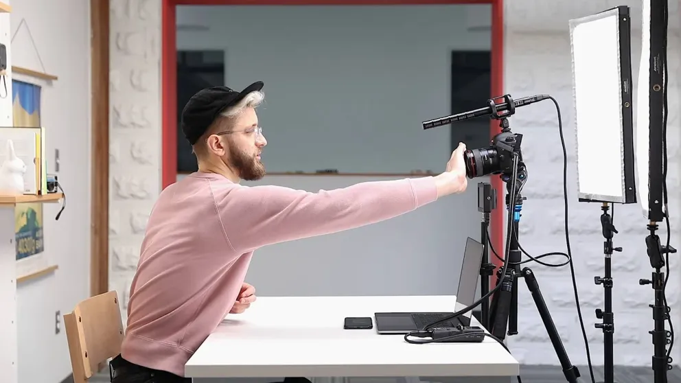 Video creator sets up a camera pointing at themselves.